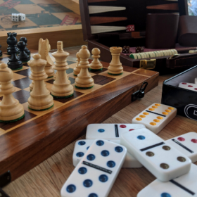 a photo of chess pieces and domino blanks 