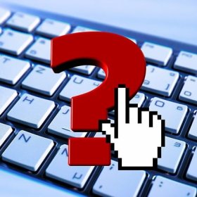 a photo of a computer keyboard with a red question mark superimposed over the top 